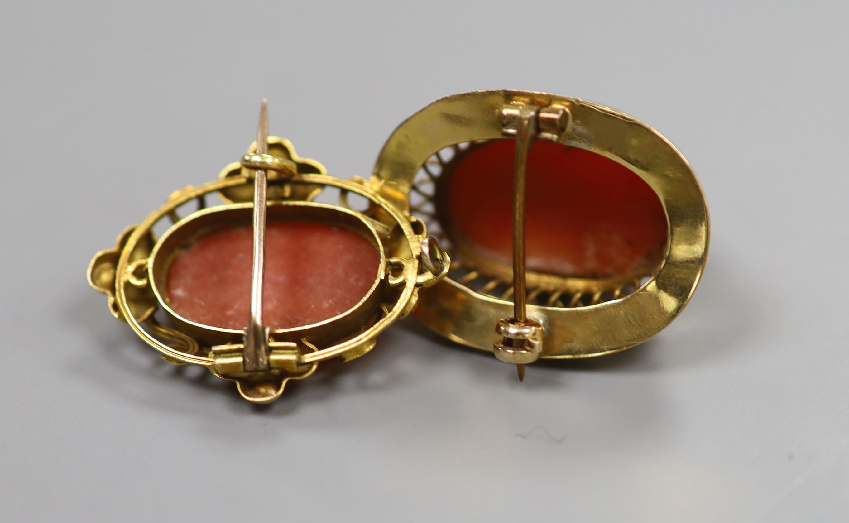 Two 19th century yellow metal and coral set oval brooches